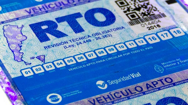 Close-up image of an RTO sticker from Argentina with blue and white details, calendar months from 01 to 18, barcode, and official logos